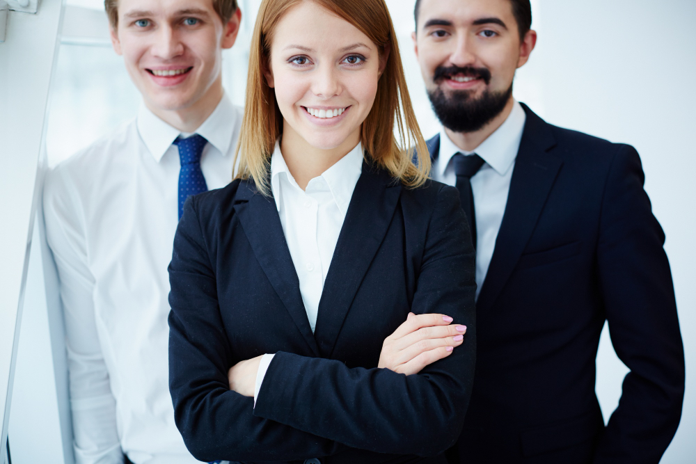 closeup proud businesswoman with colleagues